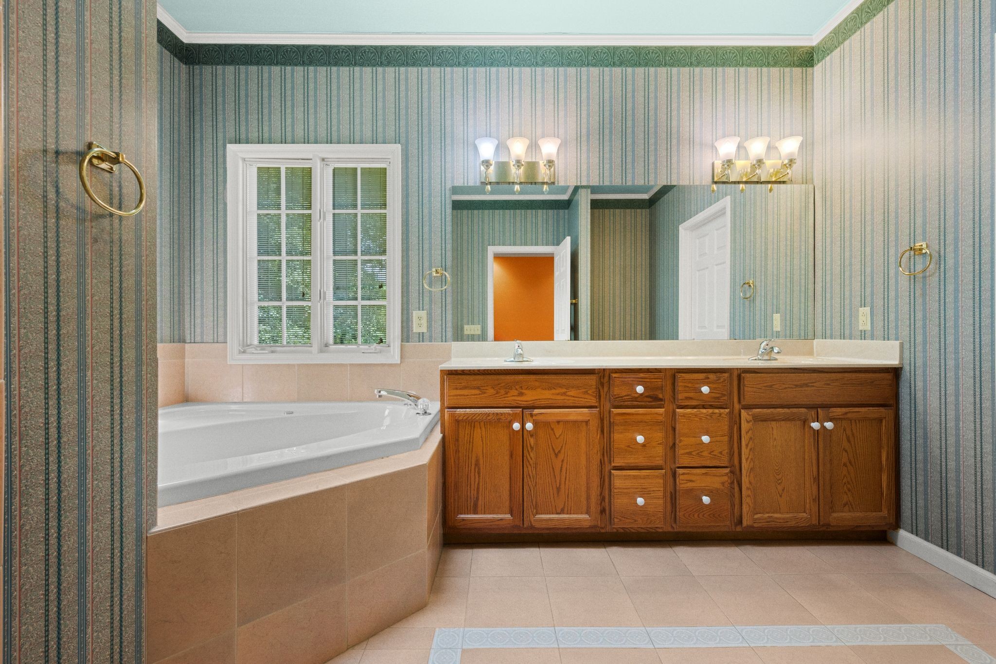 570 Gregson Place Waverly, TN 37185 - Photo 38 of 77 a bathroom with a bathtub sink and mirror