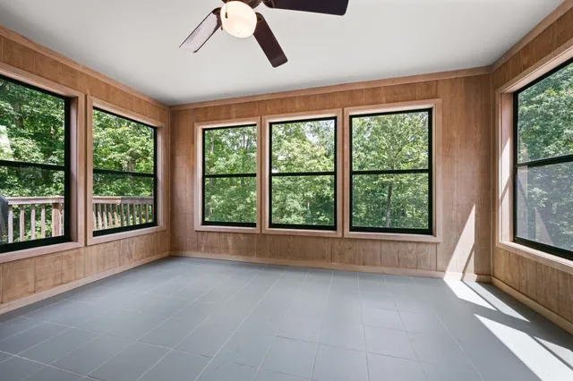 a view of a room with wooden walls
