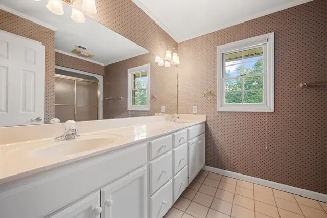 an aerial view of a house with a yard and outdoor space