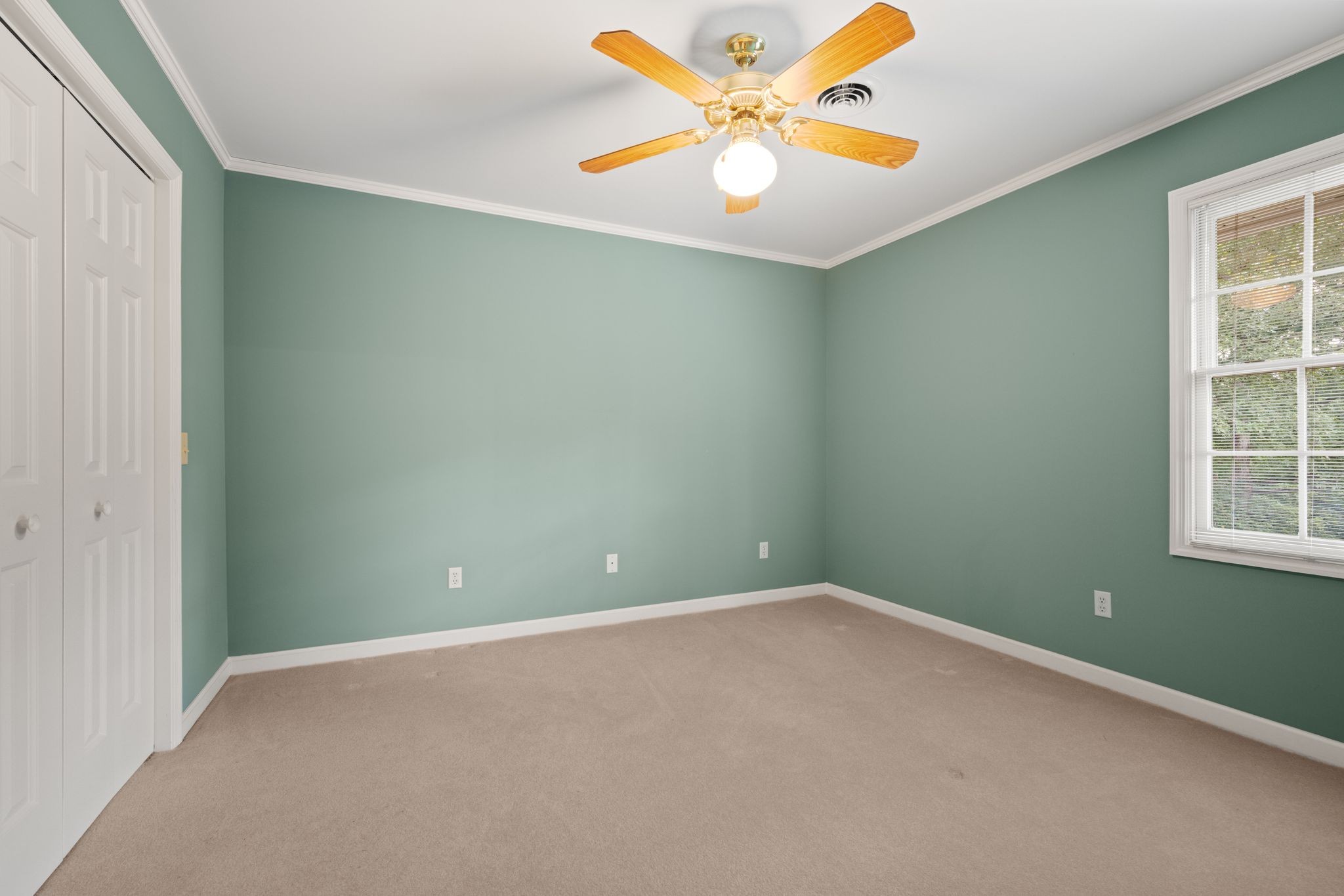 570 Gregson Place Waverly, TN 37185 - Photo 49 of 77 an empty room with a window and a fan