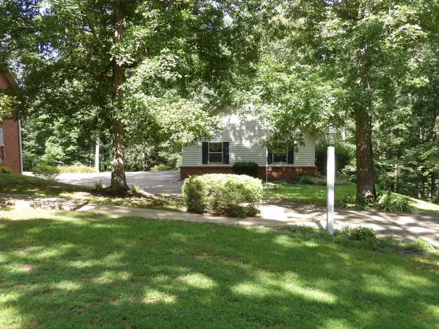 a backyard of a house with lots of green space