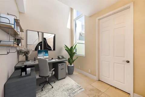 a view of a room with stairs and a window