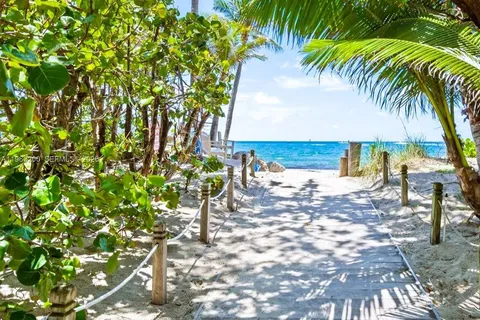 a view of a patio with furniture and a yard