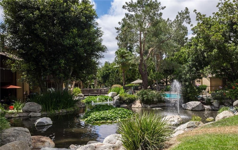 4140 Workman Mill Road, Unit 101 Whittier, CA 90601 - Photo 2 of 17 a view of a garden with a bench