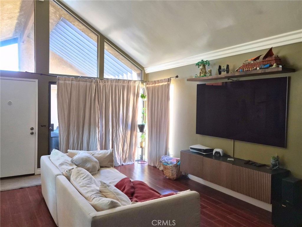 4140 Workman Mill Road, Unit 101 Whittier, CA 90601 - Photo 5 of 17 a living room with furniture and a flat screen tv