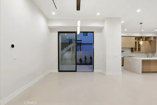 a view of entryway and hall with a front door