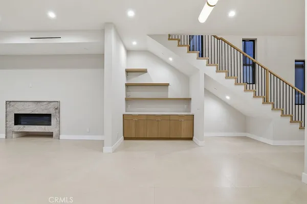 a view of an empty room with a fireplace