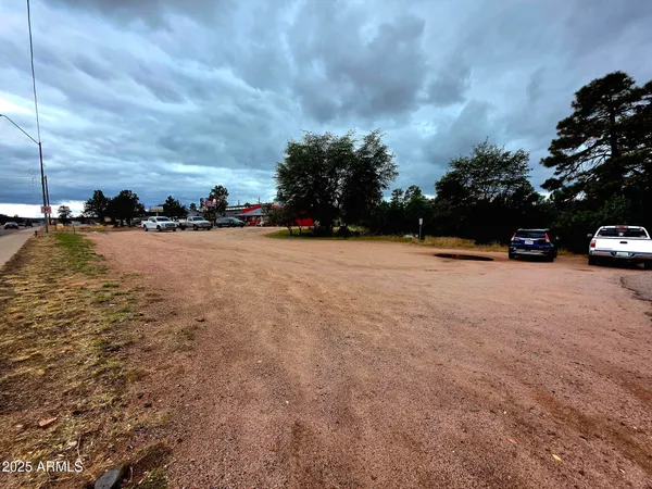 a view of street with parked cars