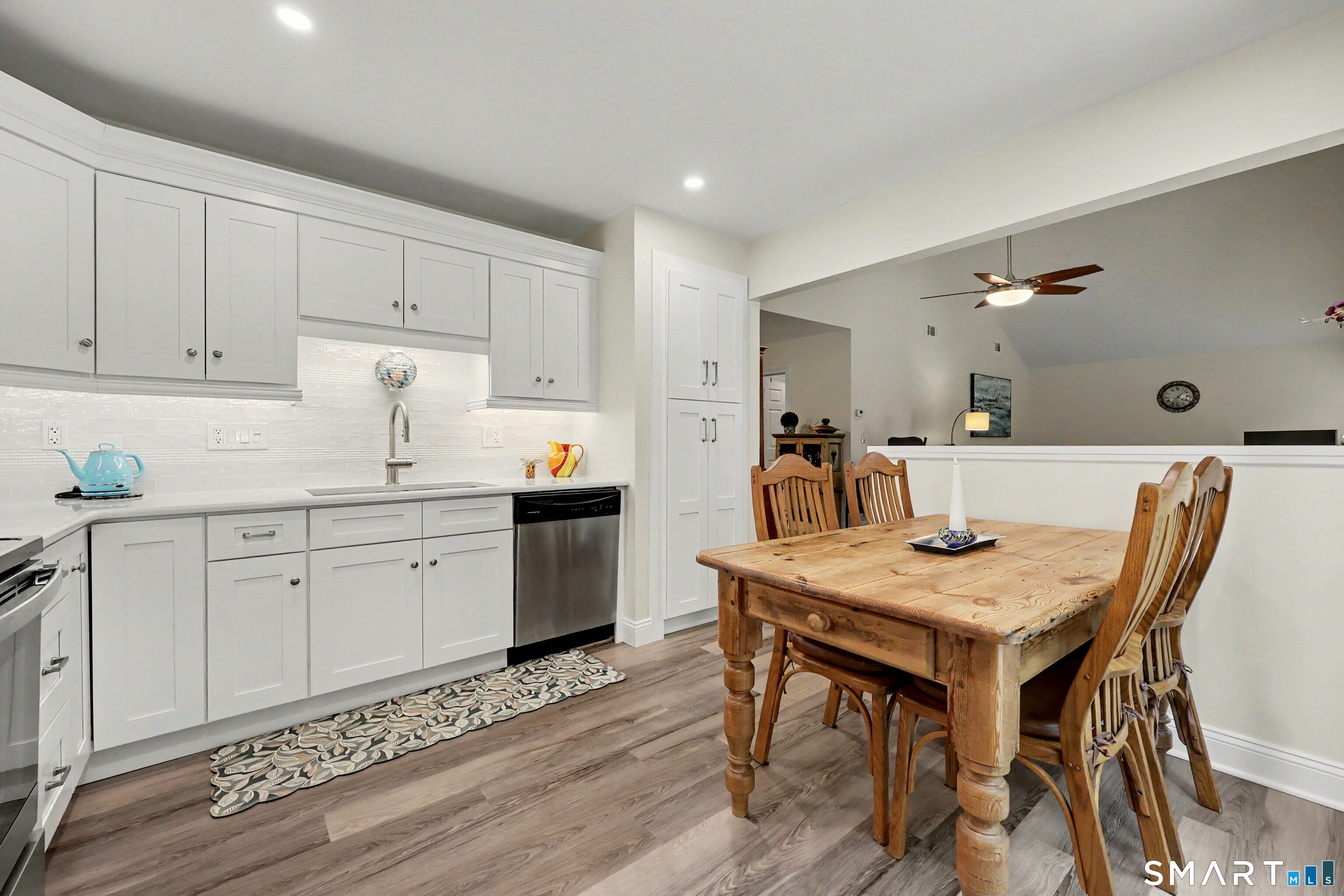 70 Fawn Ridge Lane, Unit 70 Norwalk, CT 06851 - Photo 11 of 36 a kitchen with a table and chairs