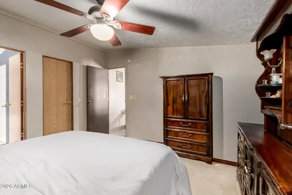 a bathroom with a double vanity sink toilet and shower
