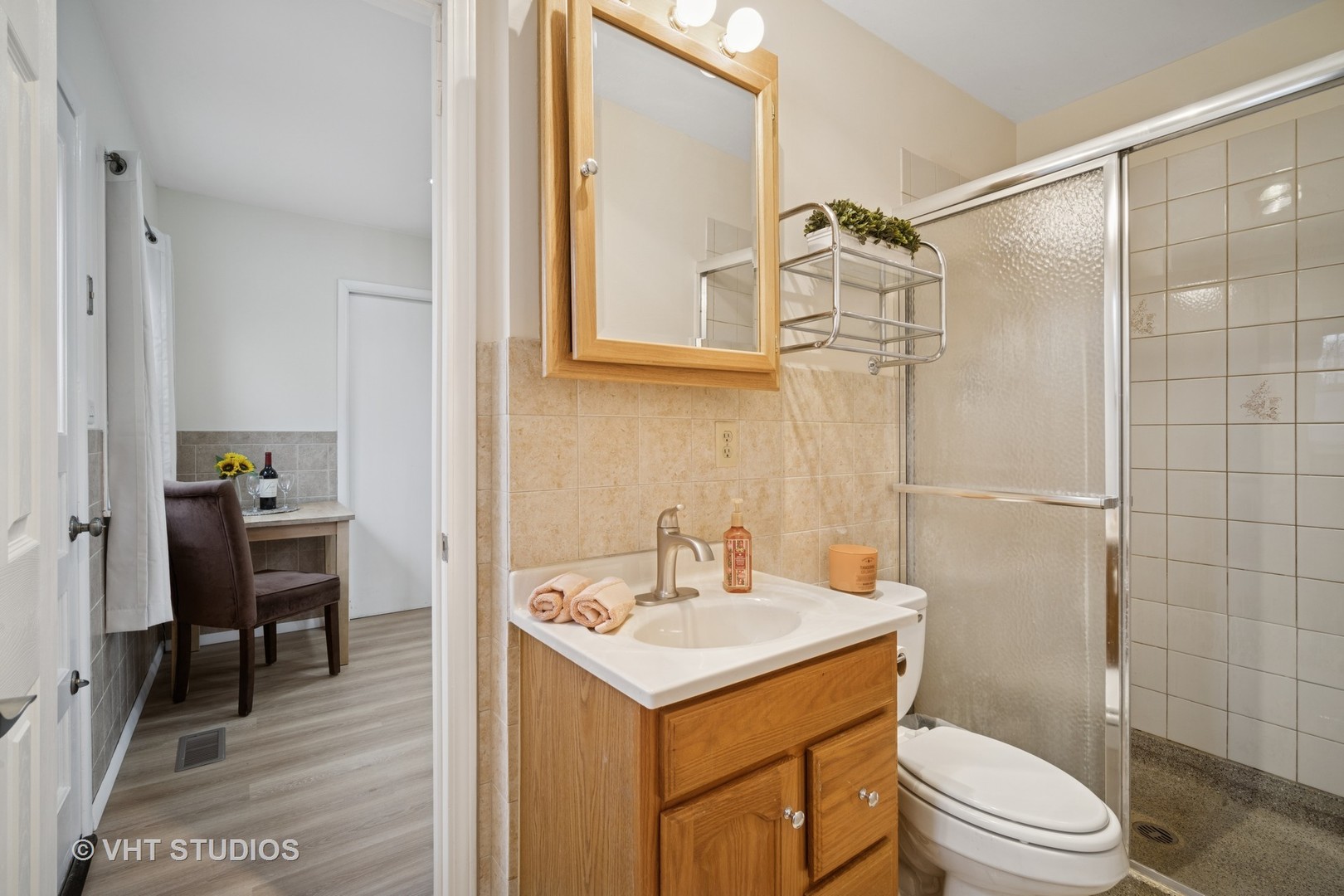185 Carthage Lane Hoffman Estates, IL 60169 - Photo 12 of 18 a bathroom with a sink toilet and shower