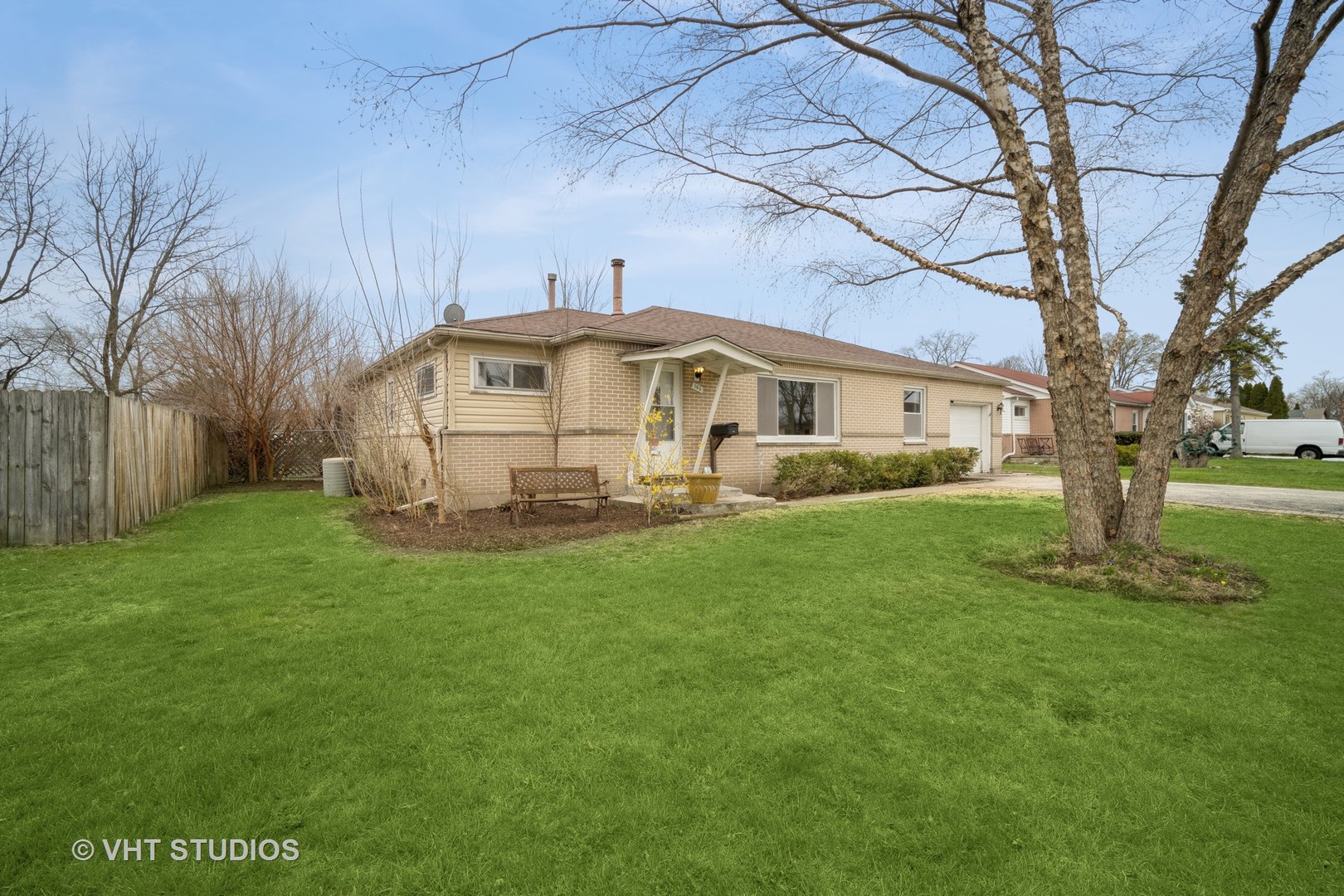 185 Carthage Lane Hoffman Estates, IL 60169 - Photo 14 of 18 a front view of a house with garden
