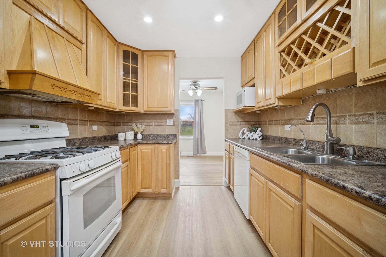 185 Carthage Lane Hoffman Estates, IL 60169 - Photo 5 of 18 a kitchen with stainless steel appliances granite countertop a sink and cabinets