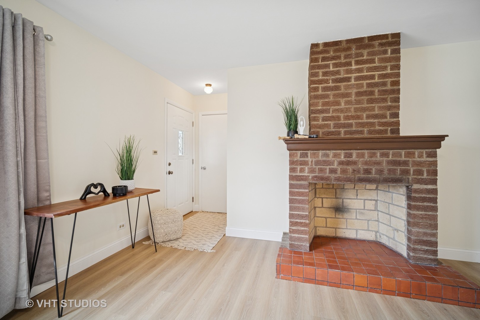 185 Carthage Lane Hoffman Estates, IL 60169 - Photo 8 of 18 a view of an empty room with a fireplace and a window