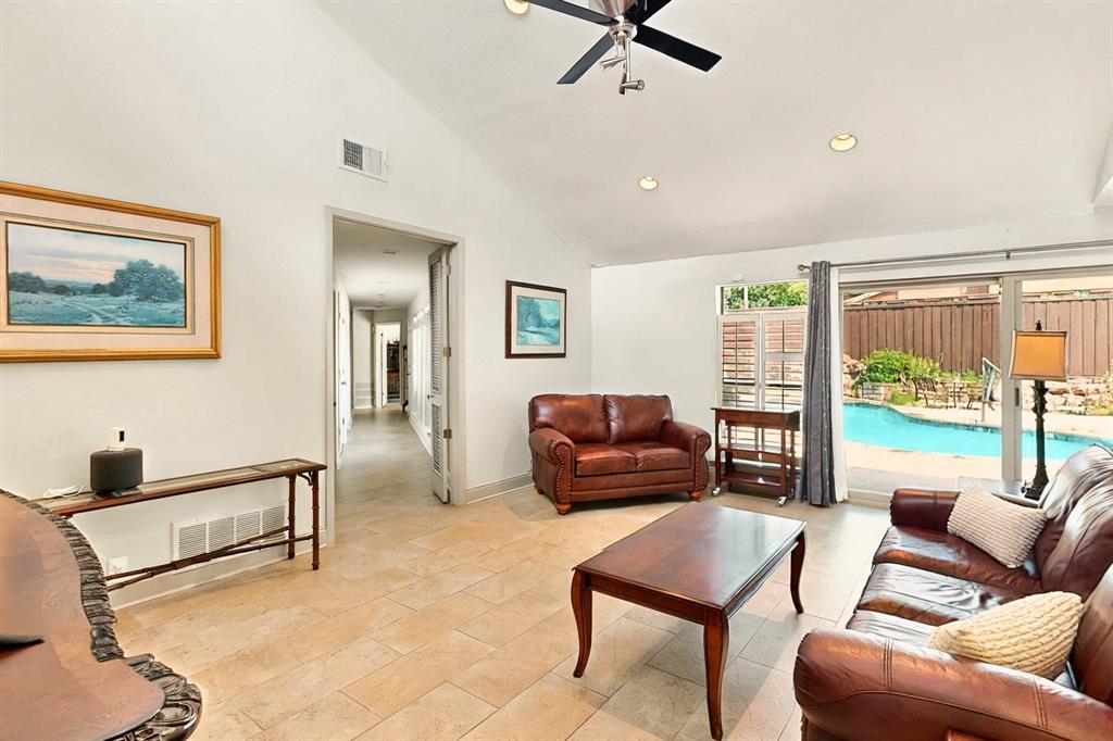7109 Alpha Road Dallas, TX 75240 - Photo 15 of 36 a living room with furniture and a window