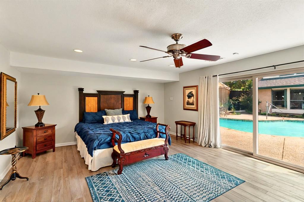 7109 Alpha Road Dallas, TX 75240 - Photo 24 of 36 a living room with furniture and a wooden floor