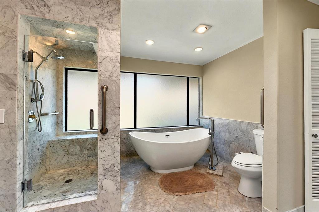 7109 Alpha Road Dallas, TX 75240 - Photo 28 of 36 a bathroom with a toilet sink and shower