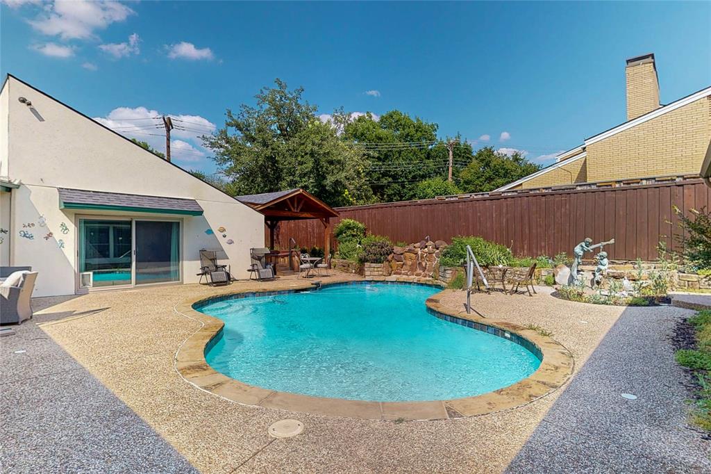 7109 Alpha Road Dallas, TX 75240 - Photo 30 of 36 a view of a swimming pool with a patio