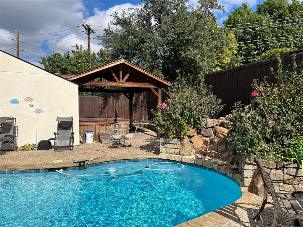 7109 Alpha Road Dallas, TX 75240 - Photo 32 of 36 a view of backyard with seating space and trees