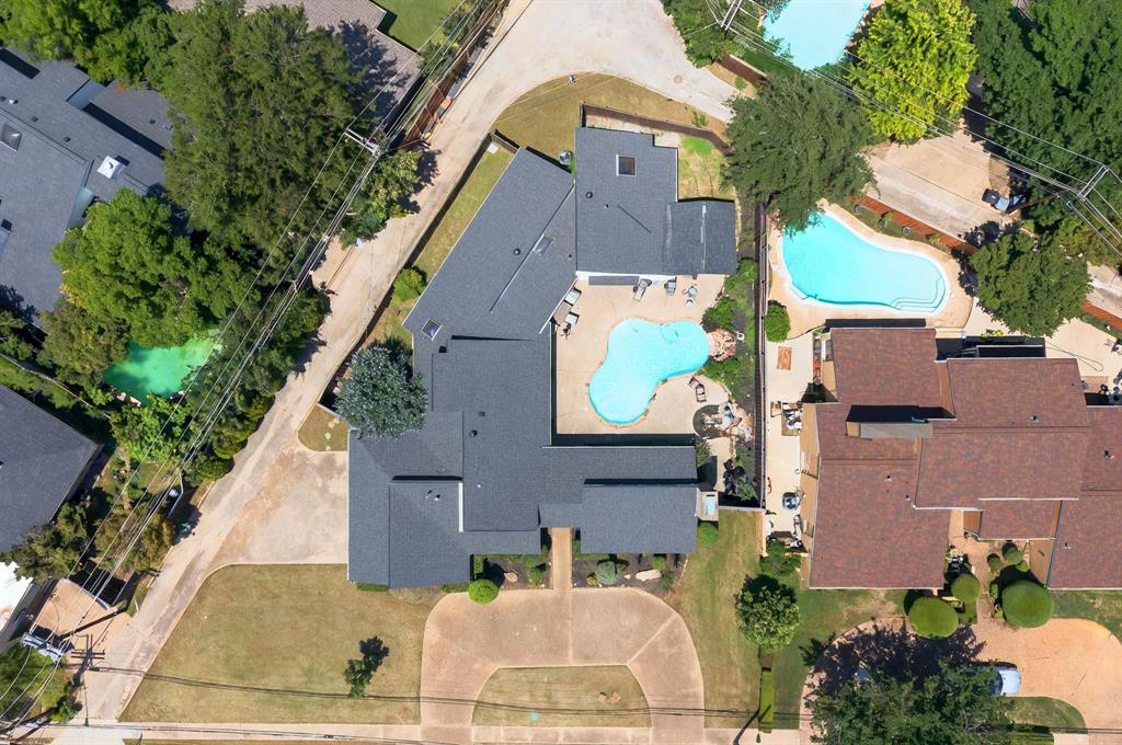 7109 Alpha Road Dallas, TX 75240 - Photo 34 of 36 an aerial view of multiple houses with a yard