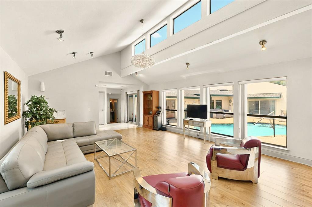 7109 Alpha Road Dallas, TX 75240 - Photo 6 of 36 a living room with furniture or couch and a large window