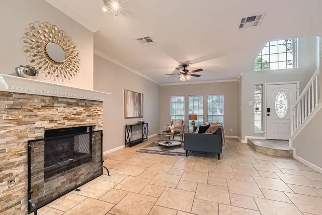 a living room with furniture and a fireplace