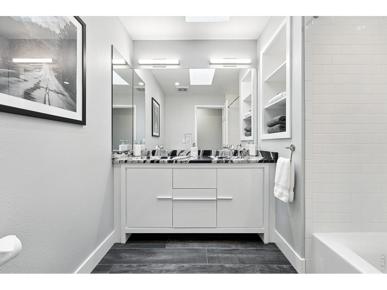 4557 Apple Way Boulder, CO 80301 - Photo 32 of 42 The accompanying bathroom is finished with fabulous countertops, adding a refined touch to a functional and well-appointed space.