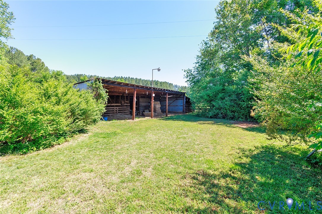 9903 Boze Road Ford, VA 23850 - Photo 30 of 45 a front view of house with yard and trees in the background