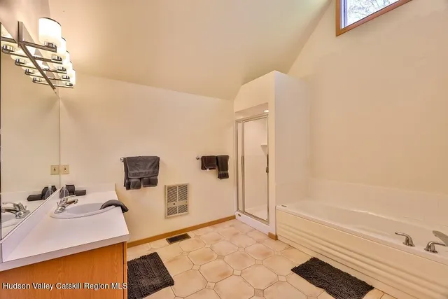 a bathroom with a toilet sink and shower