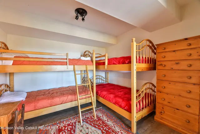 a living room with blue lights with furniture and a window