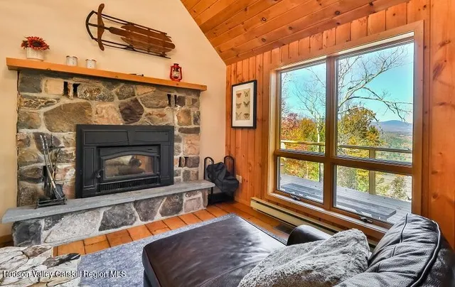 a bedroom with furniture and a fireplace