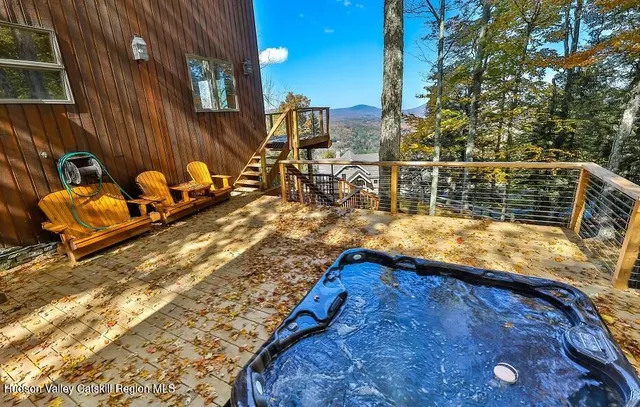 a swimming pool with view of trees in front of it
