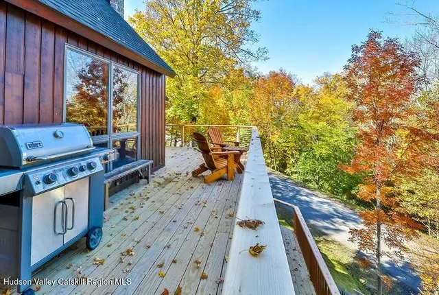 a view of a balcony with wooden floor