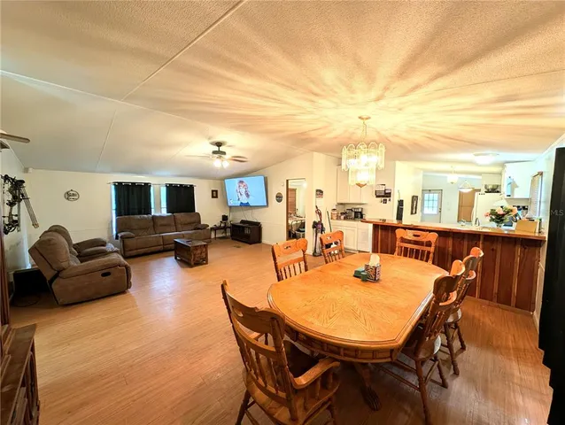 a outdoor dining space with furniture and a kitchen view