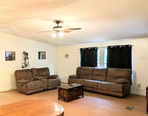 a spacious bedroom with a bed and a window