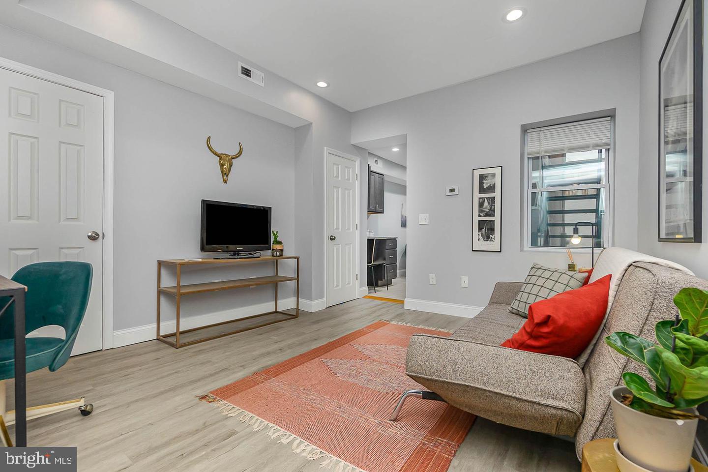 1709 Bank Street Baltimore, MD 21231 - Photo 10 of 49 a living room with furniture and a flat screen tv