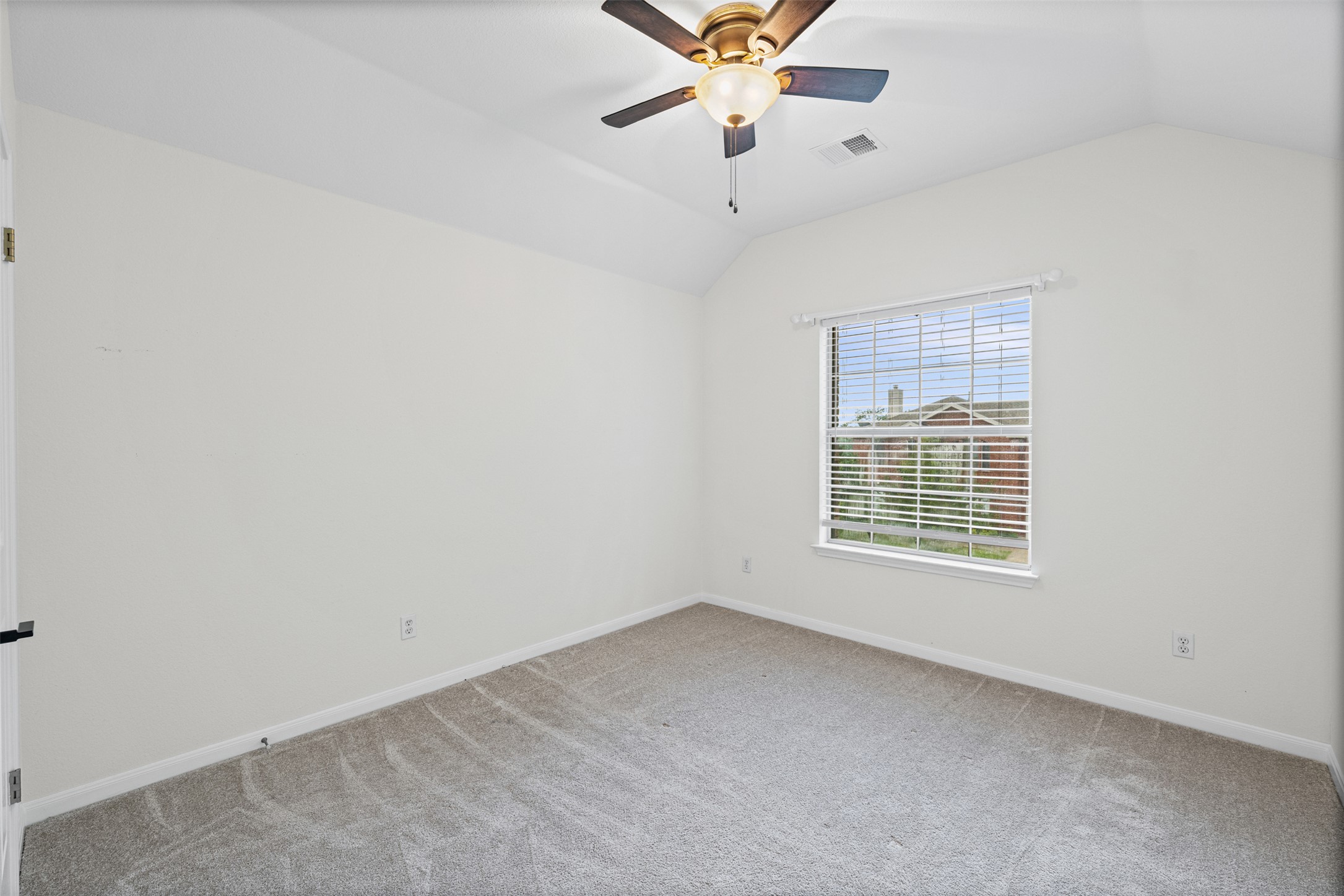 8820 Colberg Drive Austin, TX 78749 - Photo 24 of 35 A quiet bedroom with a vaulted ceiling provides a serene personal retreat.