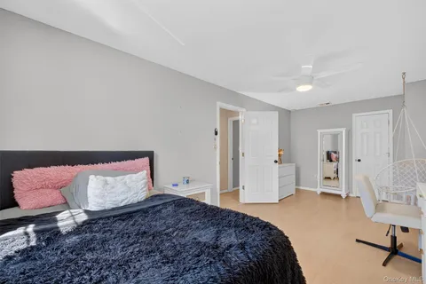 a bedroom with a bed and a chair