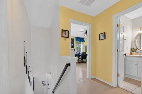 a view of a bedroom with a furniture and a bathroom