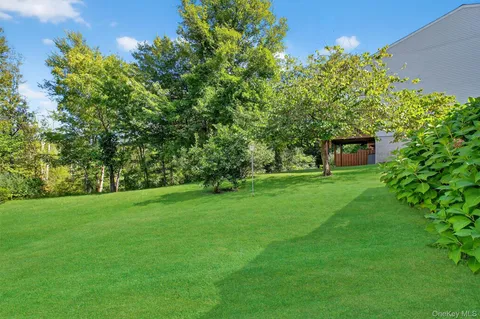 a view of a garden with a house