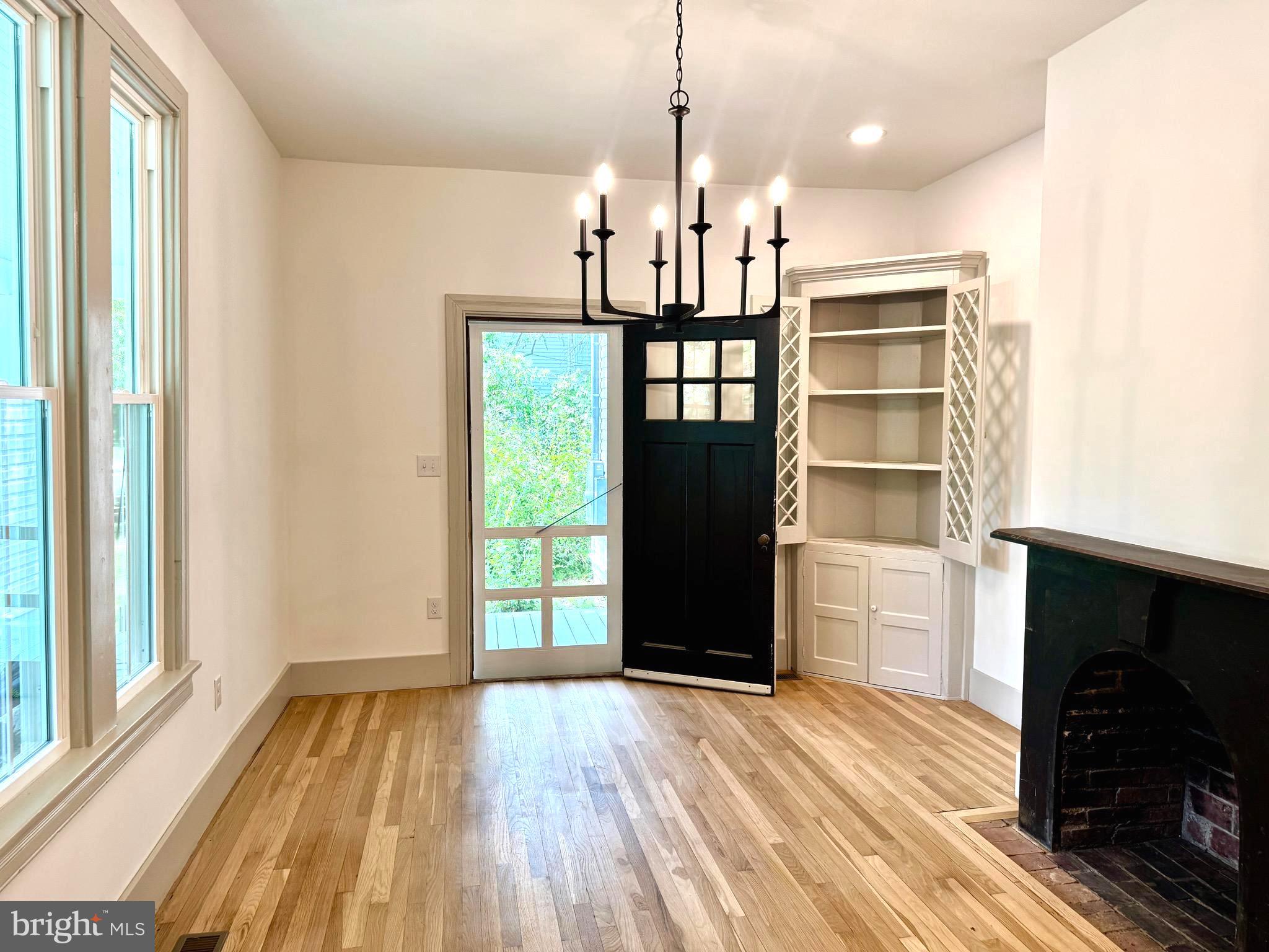3860 Main Street Trappe, MD 21673 - Photo 12 of 58 a view of empty room with wooden floor and fan