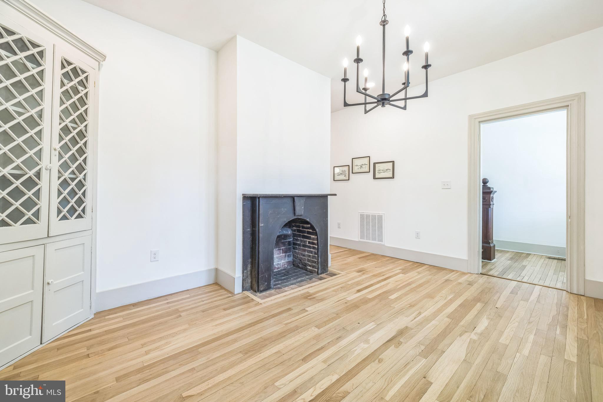 3860 Main Street Trappe, MD 21673 - Photo 13 of 58 a view of a livingroom with wooden floor and a ceiling fan
