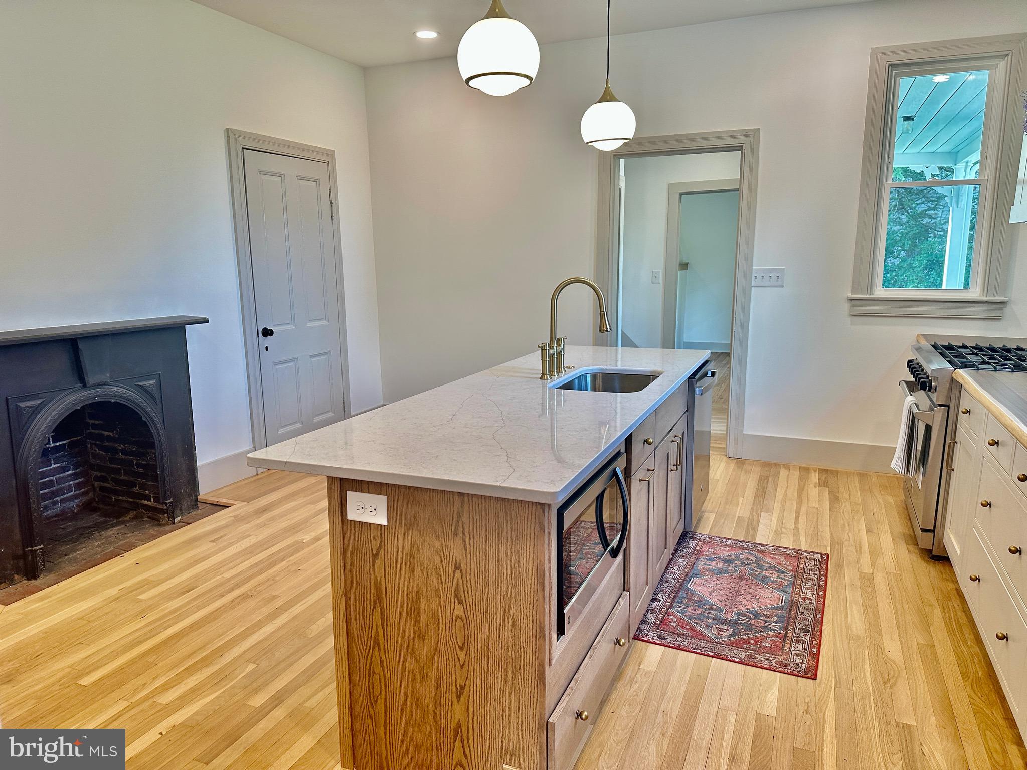 3860 Main Street Trappe, MD 21673 - Photo 21 of 58 a bathroom with a sink a mirror and a bathtub