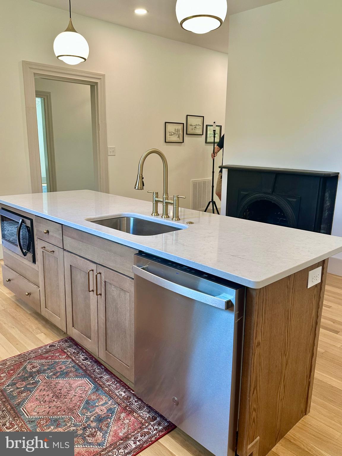 3860 Main Street Trappe, MD 21673 - Photo 22 of 58 a kitchen with a sink and a refrigerator
