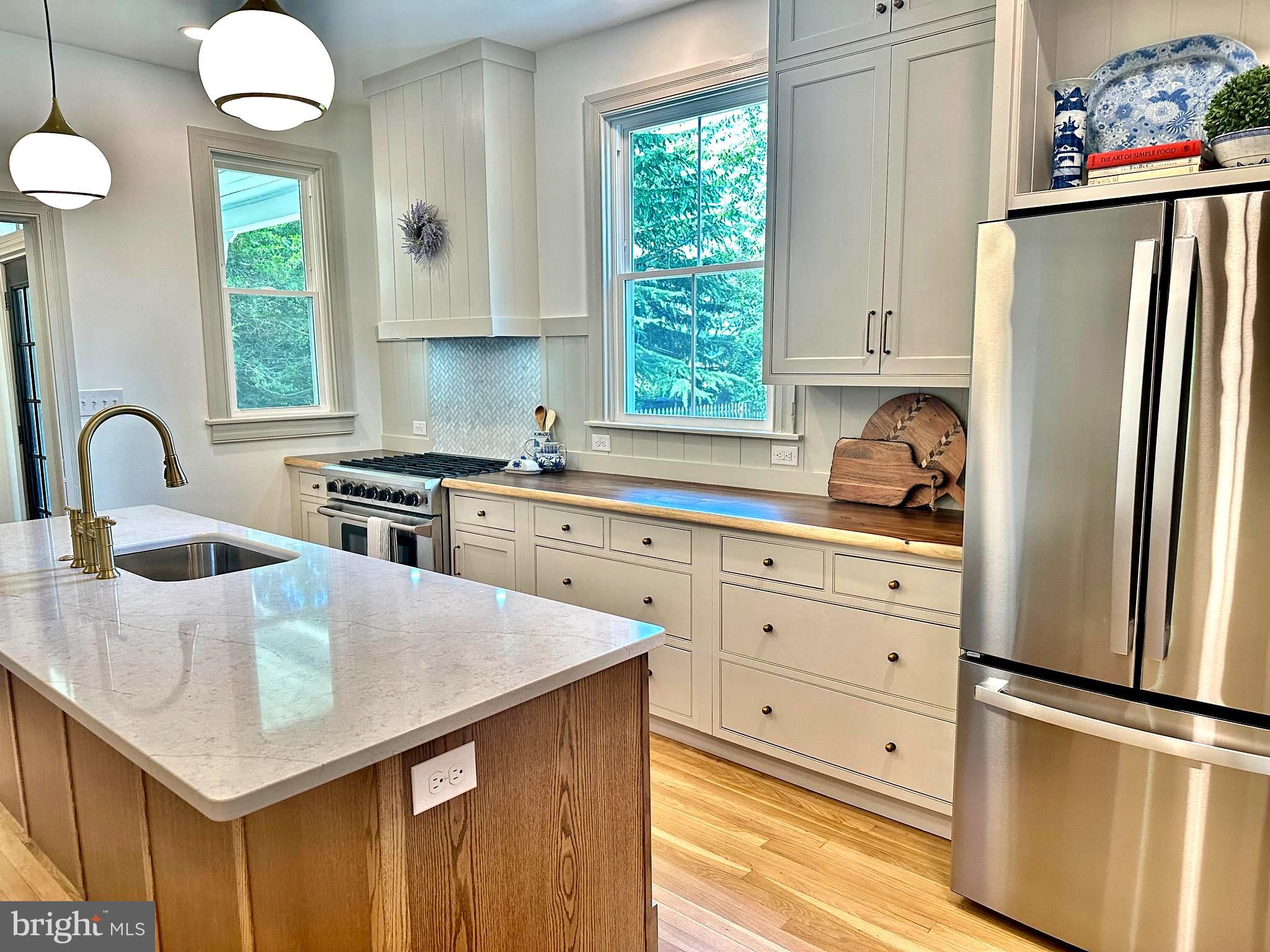 3860 Main Street Trappe, MD 21673 - Photo 23 of 58 a kitchen with granite countertop a sink stainless steel appliances and window