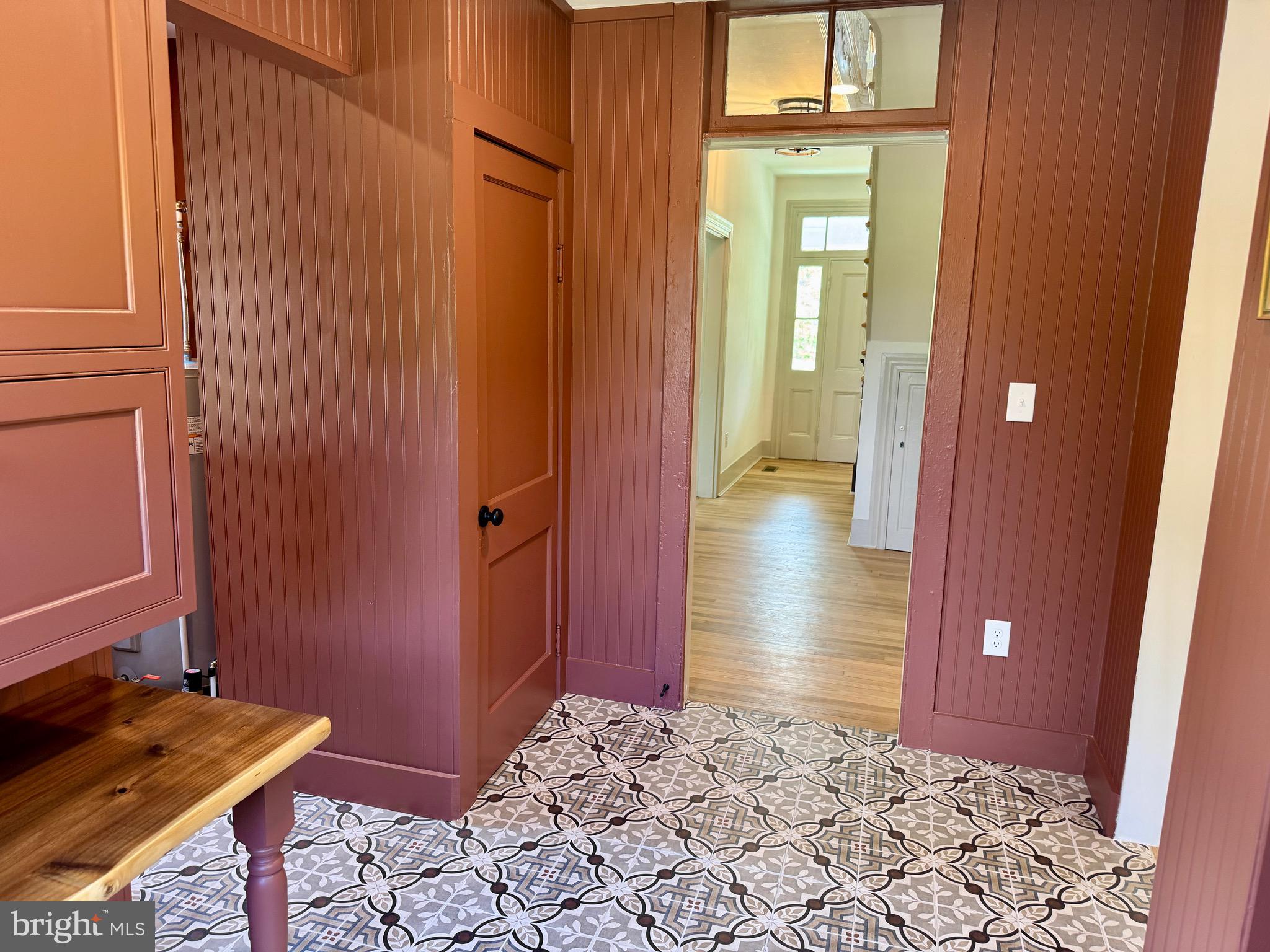 3860 Main Street Trappe, MD 21673 - Photo 24 of 58 a view of a hallway with wooden floor and a bathroom