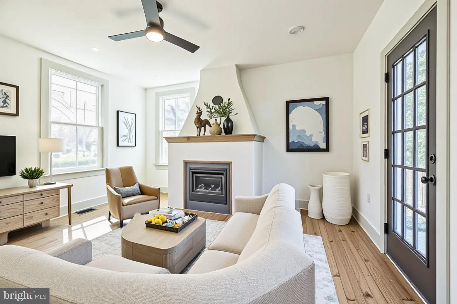 3860 Main Street Trappe, MD 21673 - Photo 30 of 58 a living room with furniture and a fireplace