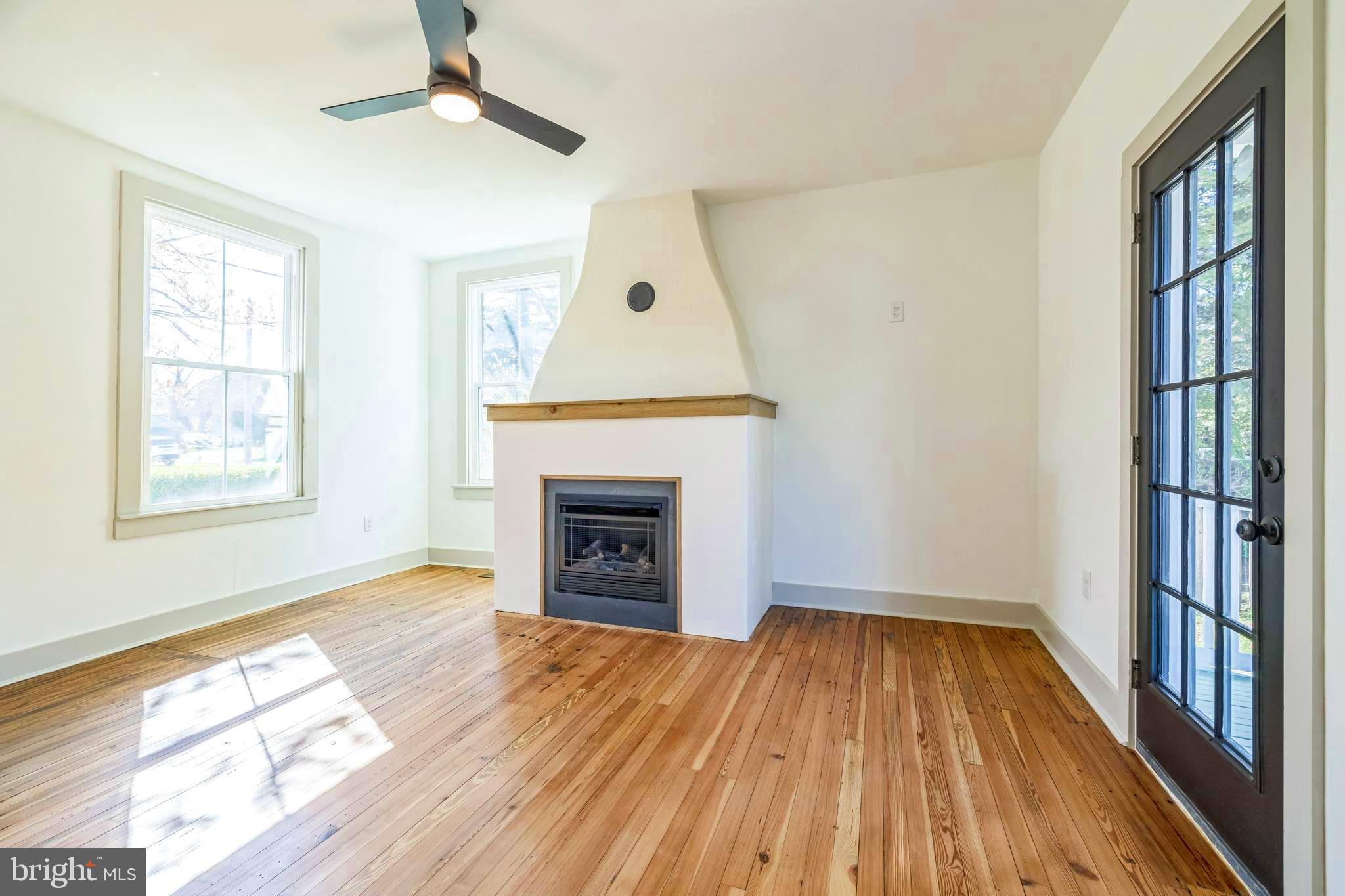 3860 Main Street Trappe, MD 21673 - Photo 31 of 58 a view of empty room with wooden floor and fireplace