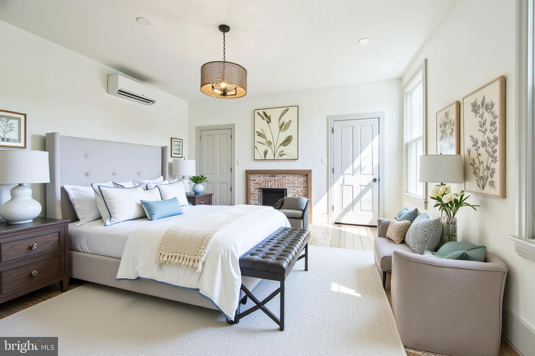 3860 Main Street Trappe, MD 21673 - Photo 34 of 58 a bedroom with a bed and a chandelier