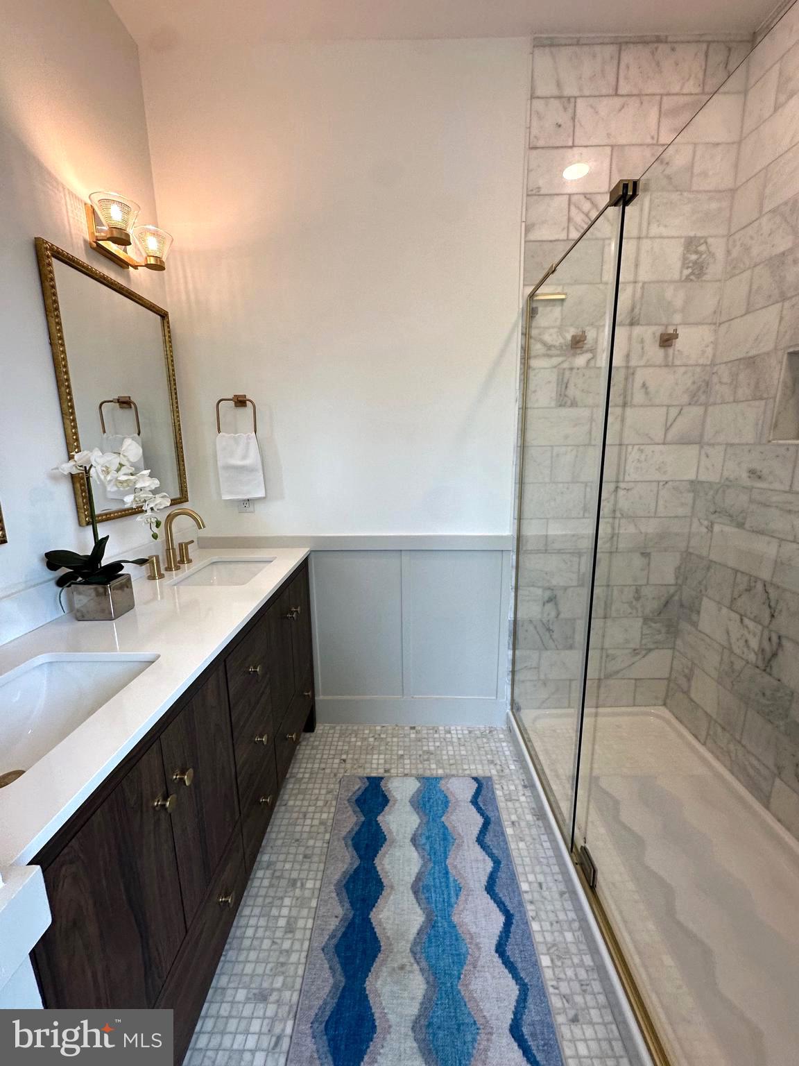 3860 Main Street Trappe, MD 21673 - Photo 37 of 58 a bathroom with a sink a toilet a mirror and shower